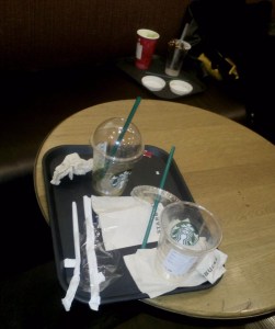 A minuscule sample (I didn't see anyone else drinking out of a mug or reusable tumbler besides myself in this busy cafe) of single use paper and plastic containers. A drink of choice was purchased and poured in, then said drink was drunk, and then they were tossed.